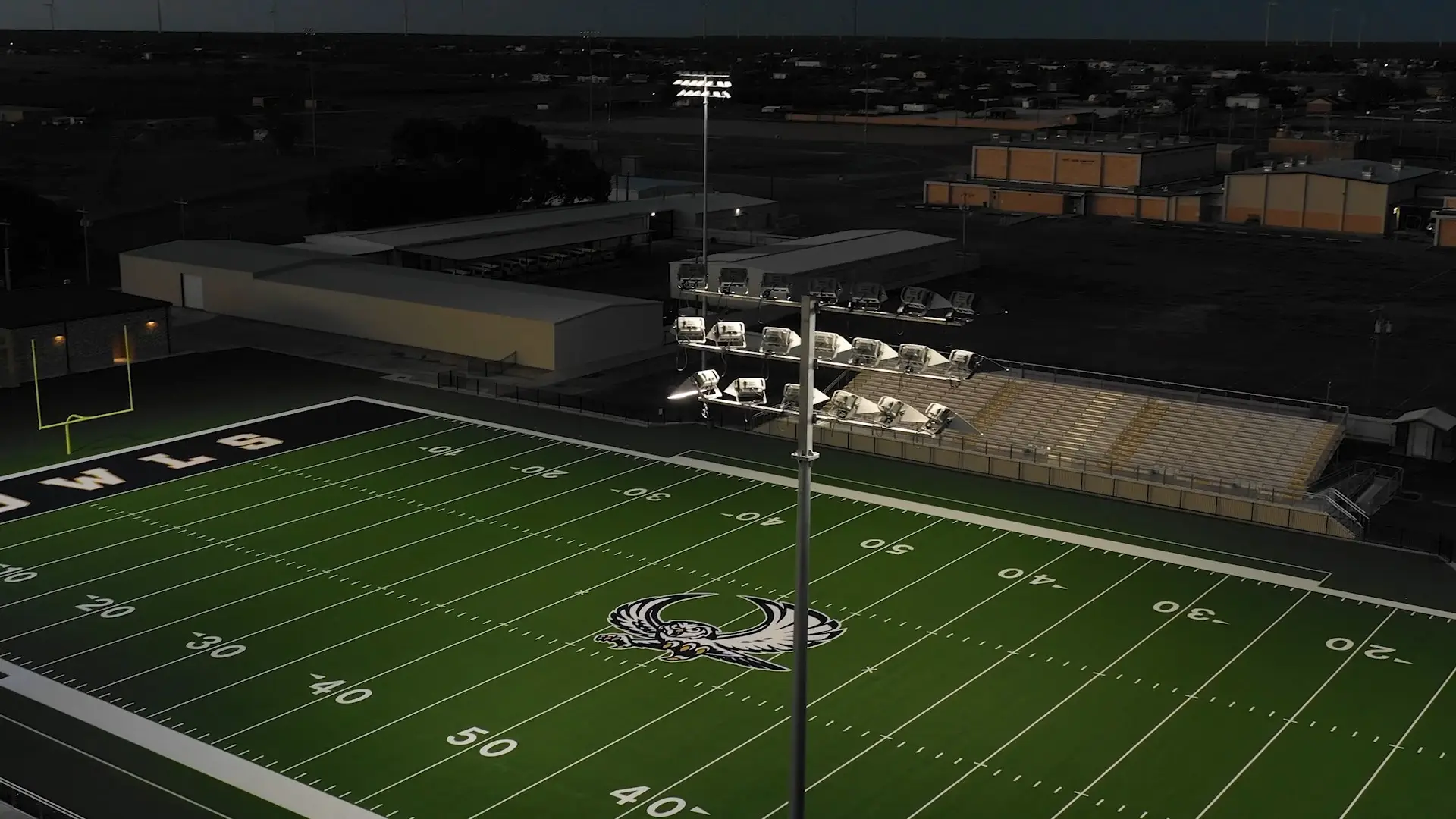 A light over a football field. Still frame from a business profile video.
